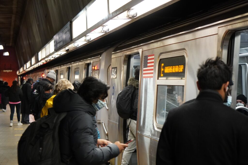 DSC01542 People boarding subway train seen in New York City in November 2021