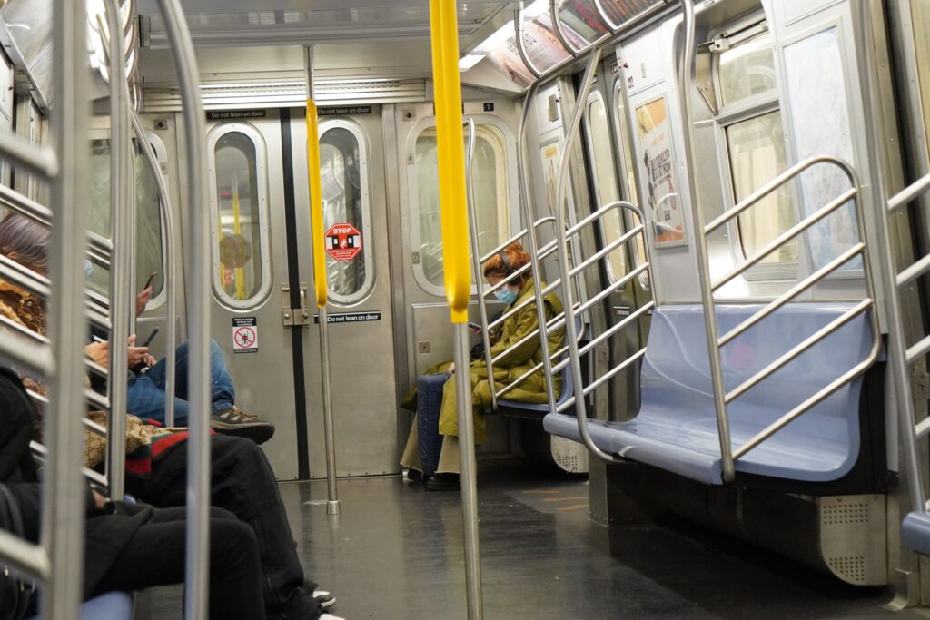 DSC01618 people on phone inside a subway train seen in New York City in November 2021